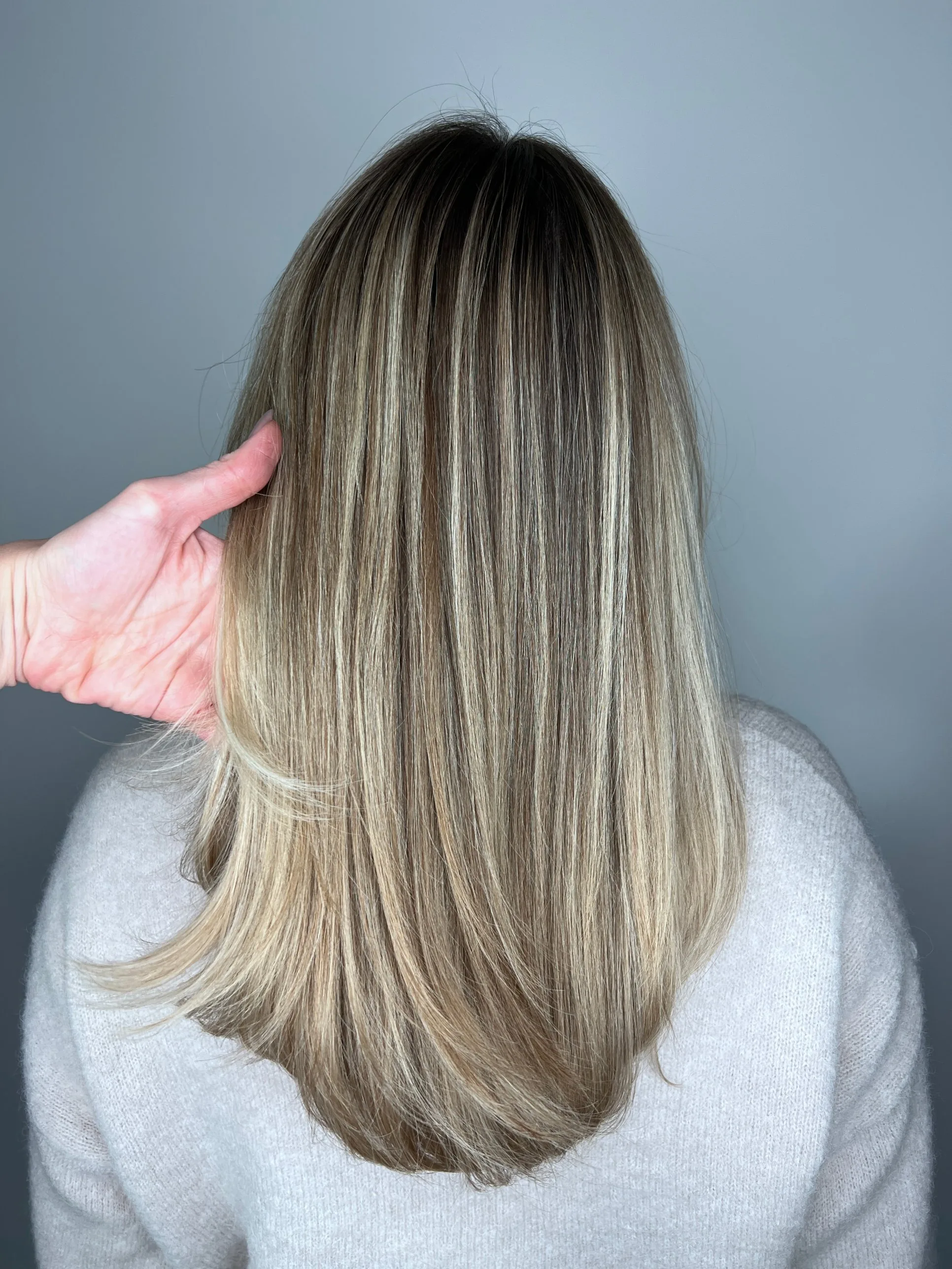 Glad, glanzend en pluisvrij haar na een Beautox treatment bij KIMBEAU